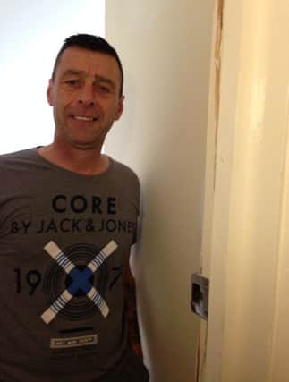 Clive Cobb had his door broken in by police when they falsely raided his flat. SUS-160226-123640001