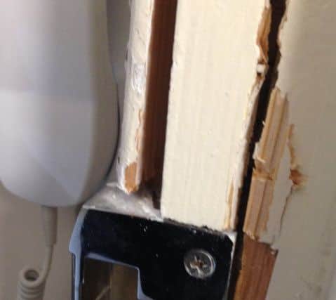 Police fitted a secure lock, but there is considerable damage to the door. SUS-160226-123651001