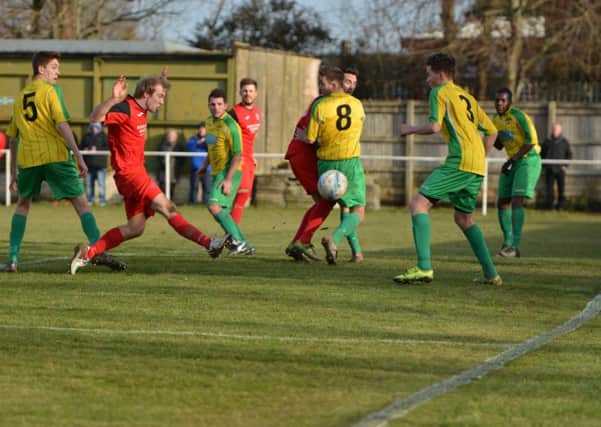 Action from Hailsham Town's 4-4 draw with Hassocks. Picture by Phil Westlake