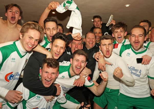 Celebrations in the Bognor dressing room after Torquay are beaten / Picture by Tim Hale
