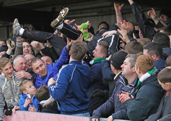 Coach Darin Killpartrick crowd-surfs after the Torquay victory / Picture by Tim Hale