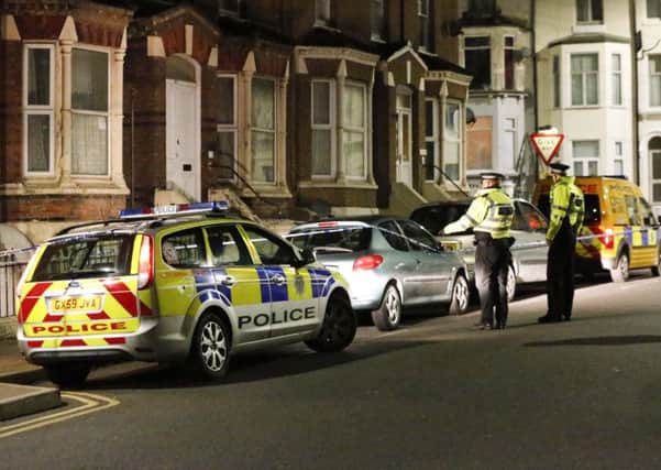 Police on Devonshire Road after a gun was fired at a house. Photo by Eddie Mitchell