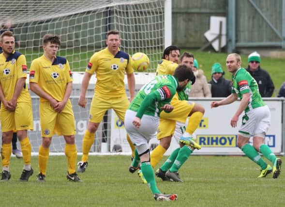Hastings United defend a free kick during their 4-1 win away to Guernsey on Saturday. Picture courtesy Joe Knight