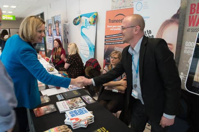 Hastings and Rye MP Amber Rudd meeting an exhibitor at the Jobs and Apprenticeships Fair