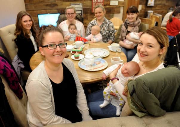 Mum Alexis Ozmen (bottom left) has set up The Nest support group to help breast-feeding mums as a result of the help she received from midwife Carolyn Hay. Pic Steve Robards SR1607191 SUS-160103-130512001