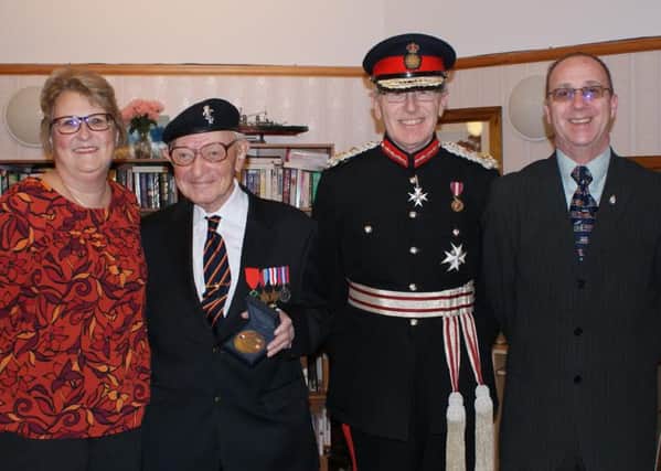 John is pictured (second left) with daughter Tricia, Lord Lieutenant of East Sussex, Peter Field, and Johns son-in-law Robin SUS-160203-160544001