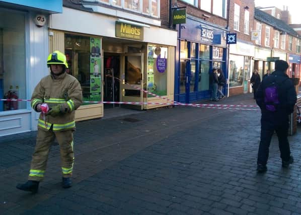 Millets has been cordoned off by firefighters