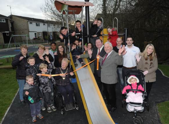 Mayor of Crawley, Councillor Chris Cheshire; Councillor Michael jones, Bewbush ward member; and Councillor Chris Mullins, Cabinet member for Wellbeing with Bewbush children at the refurbished play area SUS-160403-145342001