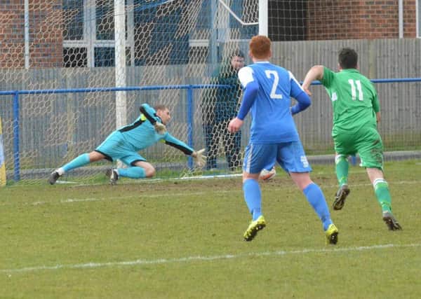 Simon Lehkyj's important penalty save. Picture by Grahame Lehkyj