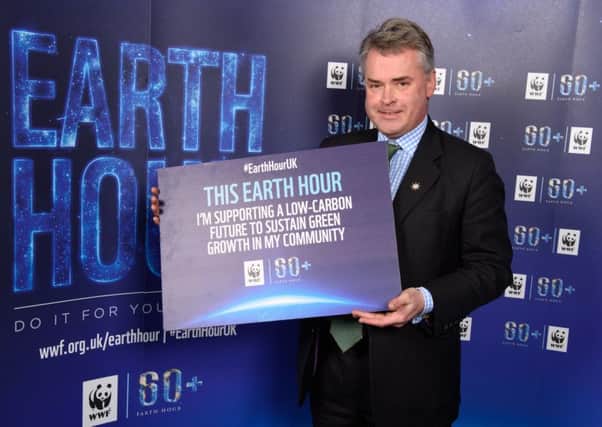 Tim Loughton, MP for East Worthing and Shoreham, supporting Earth Hour (photo by Ash Knotek, WWF-UK). SUS-160703-161714001