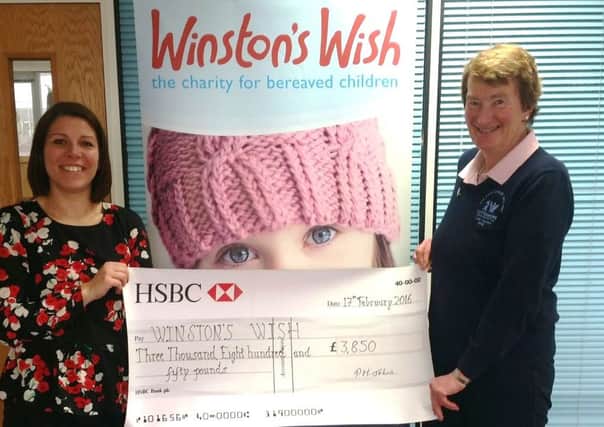 Cottesmore Golf and Country Club 2015 ladies captain Pat Johns hands over Â£4,000 raised to her chosen charity Winston's Wish - picture submitted