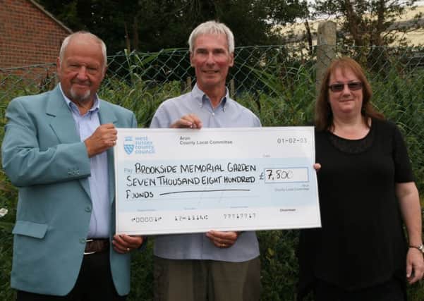 The handover of the cheque for the Brookside Memorial Garden Project, chaired by Sue Sula.