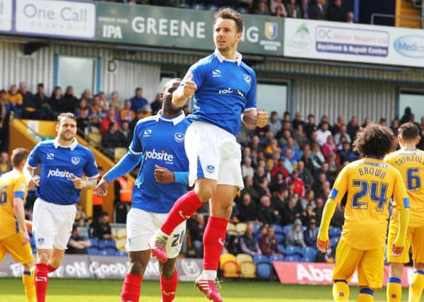Matt Tubbs celebrates after opening the scoring on Pompey's last visit to Mansfield. Picture: Joe Pepler