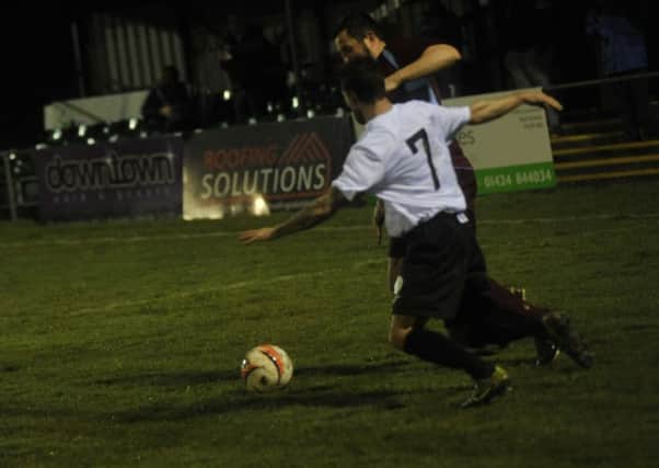 Steve Mote in the thick of the action during Little Common's 3-0 defeat at home to Haywards Heath Town on Tuesday night. Picture by Simon Newstead (SUS-160903-093502002)