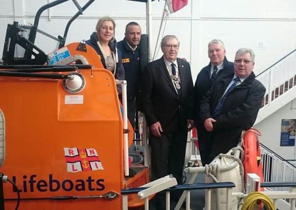 (L-R) Hastings Lifeboat's deputy second coxwain Sloane Phillips, coxwain Steve Warne, St Leonards Rotary Club president Ray Howard, Lifeboat operations manager Peter Adams and rotarian John Easter