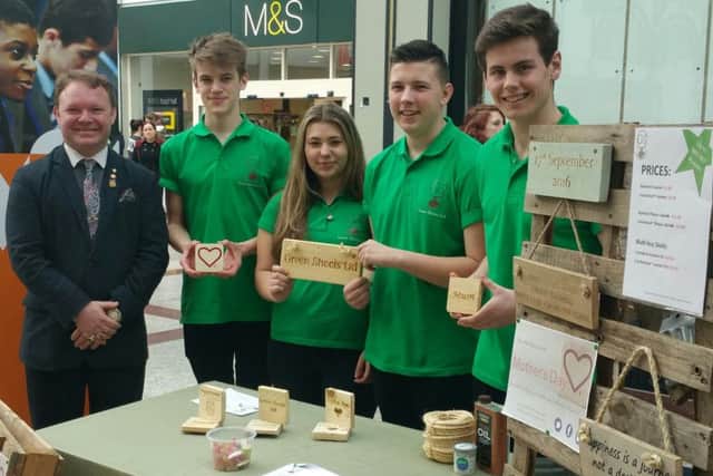 Highworth Grammar School students at the Priory Meadow trade fair with their company Green Shoots and Brett McLean