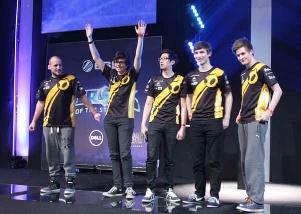 Team Dignitas' Thomas Cailleux, Josh Bennett, JÃ©rÃ´me Trinh, James Baker and Jonathan Gunnarsson on stage after winning the Heroes of the Storm European championships in Poland