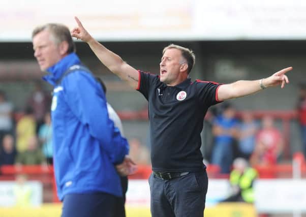 Crawley Town manager Mark Yates shouts instructions SUS-150921-133530002