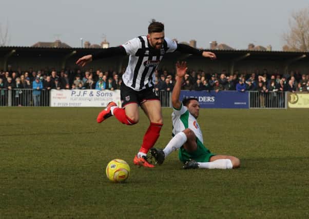 Alex Parsons tackles Danny East as the Rocks take on Grimsby at Nyewood Lane / Picture by Tim Hale