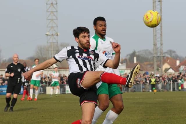 Chike Kandi battles for possession against Grimsby / Picture by Tim Hale
