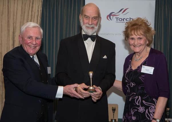 John and Kay Price receive their award from Prince Michael of Kent
