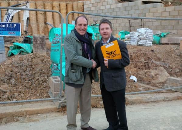Nick Perry discussing housing issues with former deputy Party leader Sir Simon Hughes in Nelson Road during his recent visit to the town