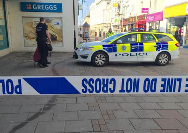 Police have taped off the area outside Poundland. Photo by Eddie Mitchell.