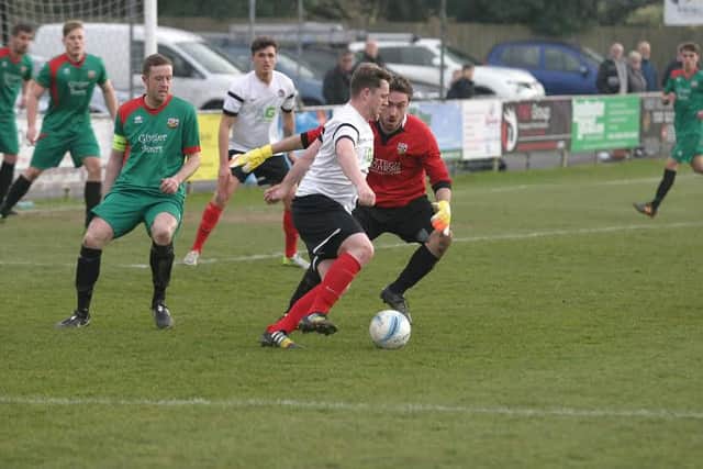 YM`s Sam Schaaf takes on Pagham `keeper, James Binfield. Photo by Clive Turner.jpg SUS-160315-103207002