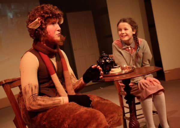 Lucy Pevensie (Anna Record) meets Mr Tumnus (Tom Carey). Picture by Stephen Candy