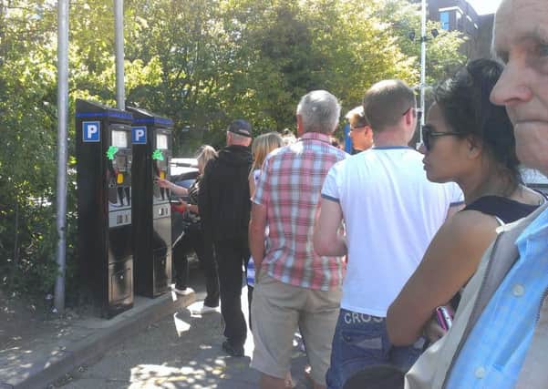 Car park users queuing at the pay machines last year