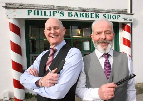 DM1618019a Retiring Littlehampton barber Philip Carter, left, with his colleague Jim Jarvis, who will be taking over the shop