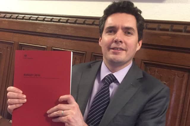 Huw Merriman MP with the budget in hand SUS-160317-103059001