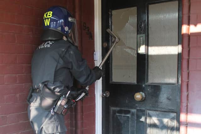 Thirty police raided five addresses in Littlehampton and Pulborough