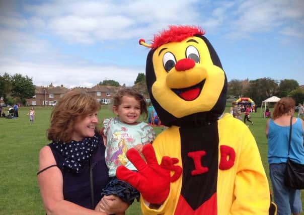 Sid the Heart of Sidley mascot at a family fun day