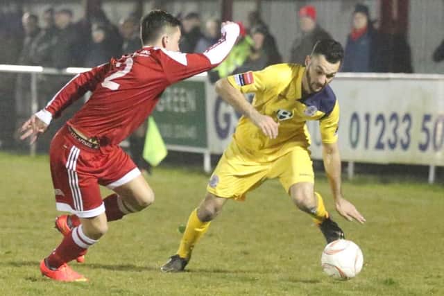 Hastings United wide player Jack McLean tries to take on the Hythe Town full-back. Picture courtesy Scott White