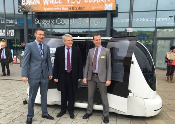 East Sussex Rail Alliance's Ray Chapman, road minister Andrew Jones and TRL's Nick Reed with a driverless car