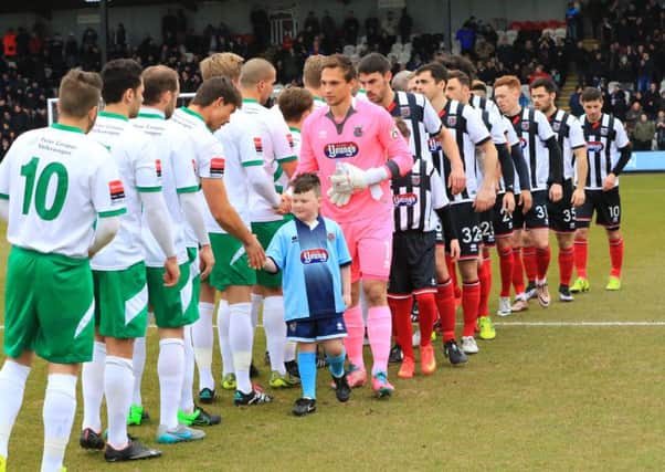 The teams shake hands before the second leg / Picture by Tim Hale