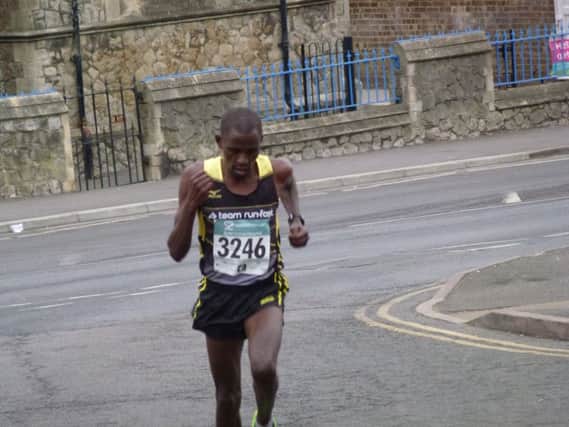 Robert Mbithi on his way to winning the Hastings Half Marathon. Picture by Simon Newstead (SUS-160320-141951002)