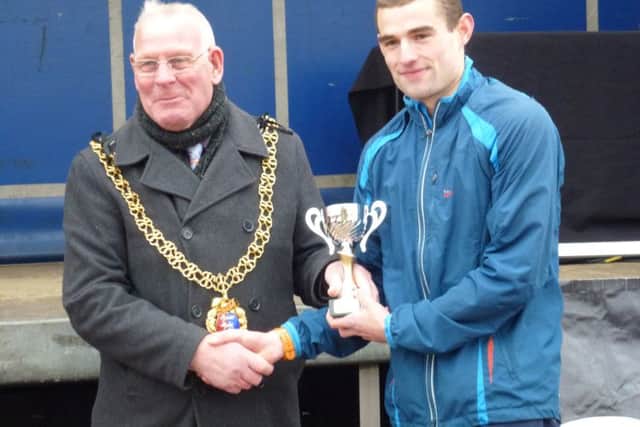 Rhys Boorman receives his third place trophy from town mayor Cllr Bruce Dowling. Picture by Simon Newstead (SUS-160320-142127002)