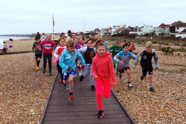 Lighthouse Class running a mile along the board walk on Shoreham Beach and back