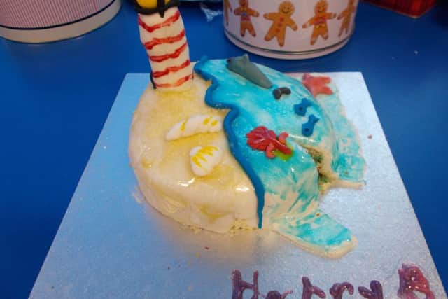 Year-one pupil Harry Baker designed his cake to incorporates all the school's class names - Minnows, Seashells, Starfish, Dolphins, Lighthouse, Coral and Ocean