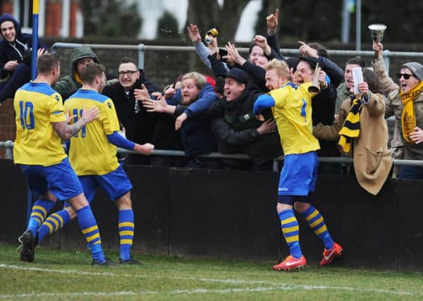 Eastbourne Town celebrate  96th minute winner at the Saffrons
