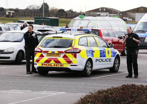 Police arrested four men in the supermarket car park in Ferring