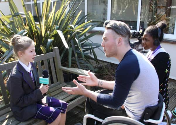 Year 7 student Aimee Brown being interviewed by Newsround reporter Martin Dougan during a visit to Worthing High School