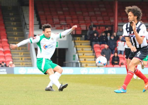 Alex Parsons gets in a cross at Grimsby / Picture by Tim Hale