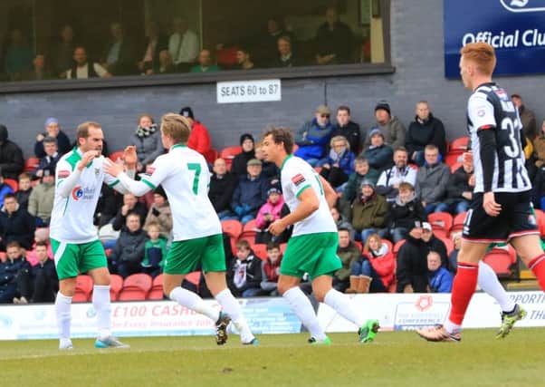 The Rocks celebrate their equaliser at Grimsby / Picture by Tim Hale