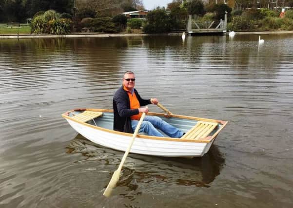 Mewsbrook Park cafe owner David Chance on one of the new wooden boats in the boating lake