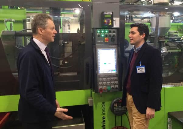 Marshall-Tufflex's production and assembly manager Keith Graham and Bexhill and Battle MP Huw Merriman on a tour of the factory