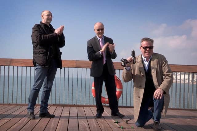 (L-R) Hastings Pier Charity chief executive Simon Opie, Heritage Lottery Fund south east committee chairman Paul Hudson and Suggs on the refurbished pier