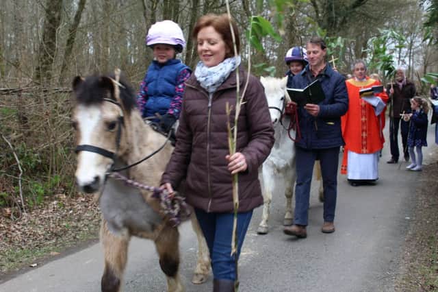 The Sussex ponies Pogle and Twinkle lead The Revd. Rupert Toovey and the Palm Sunday Procession at Ashurst.